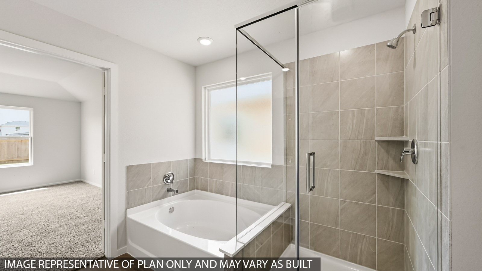 primary bathroom with separate tub and shower