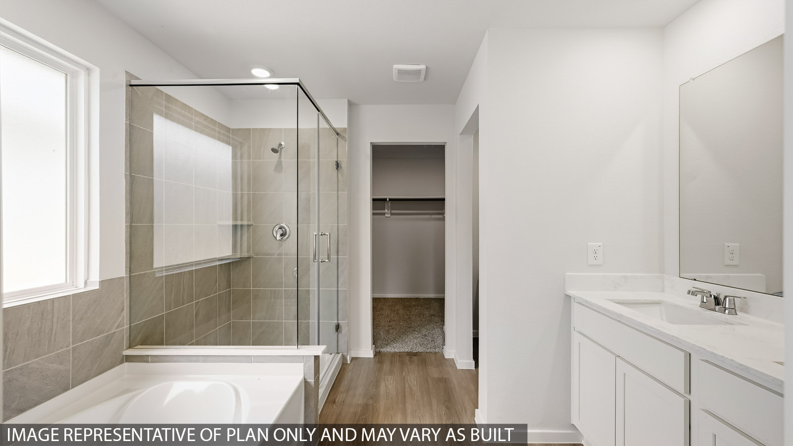 primary bathroom with separate tub and shower