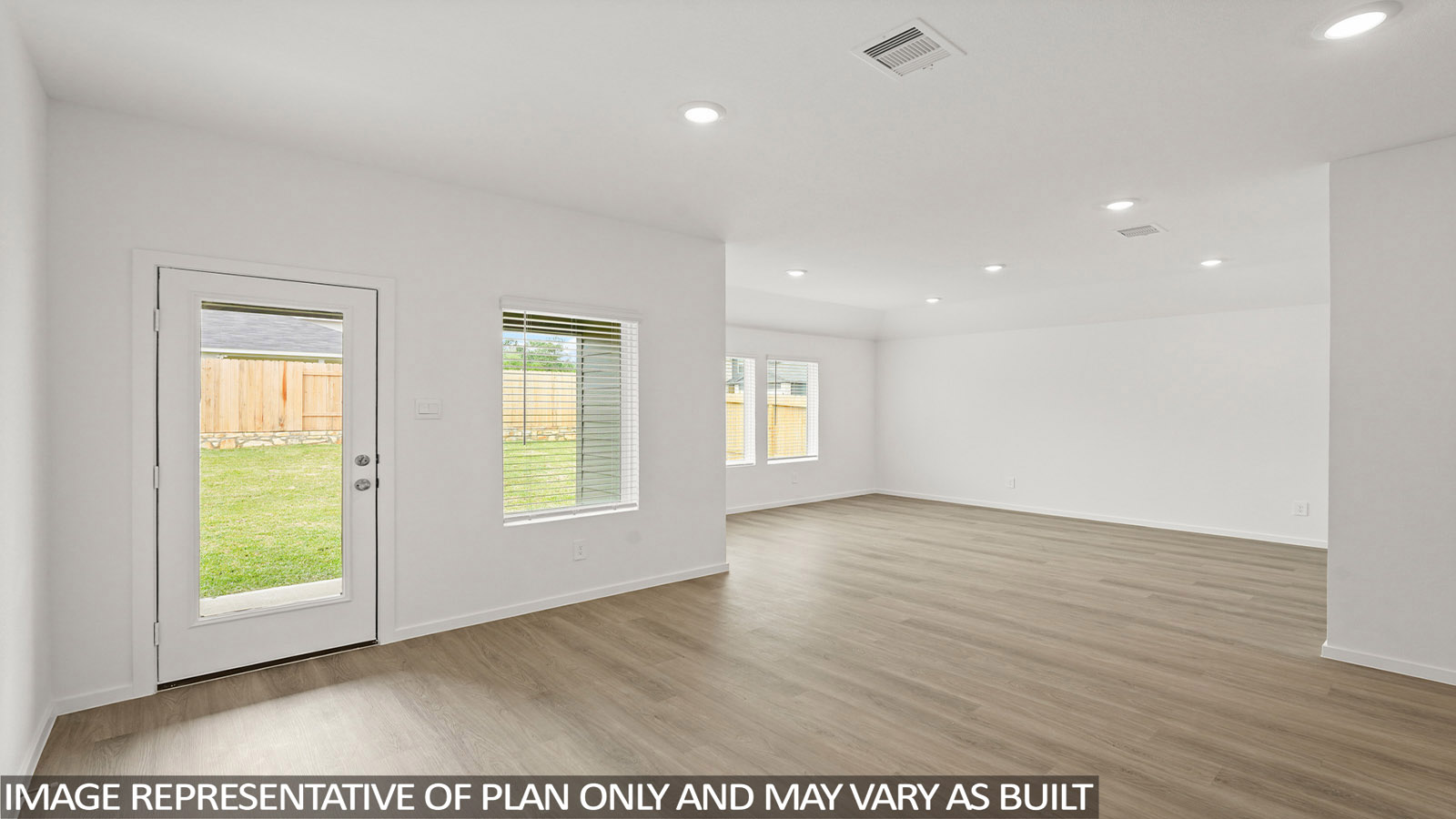 open concept living and dinnig area with vinyl flooring and large windows