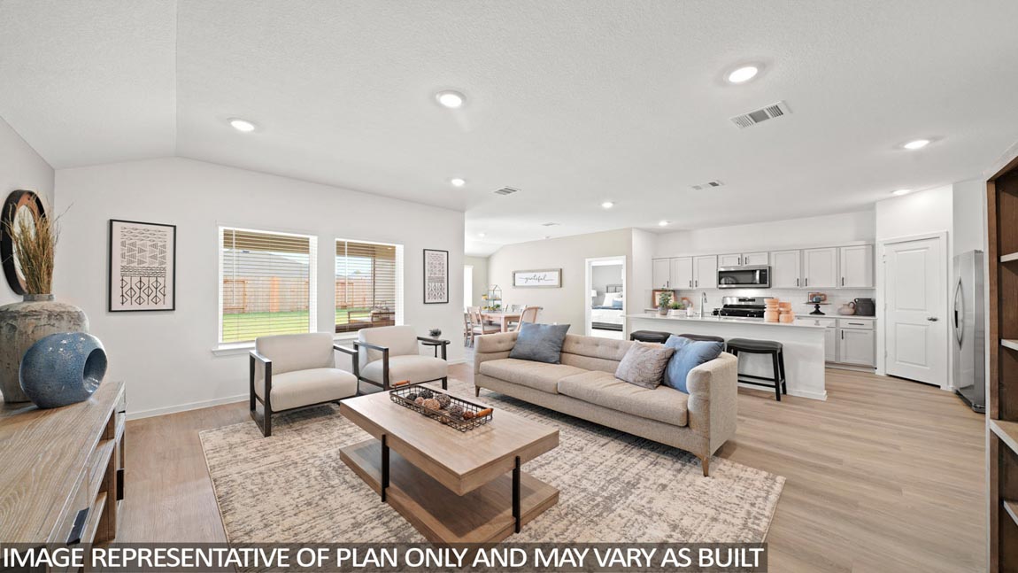 open concept livivng and dining area with vinyl flooring, quartz countertops, and large windows