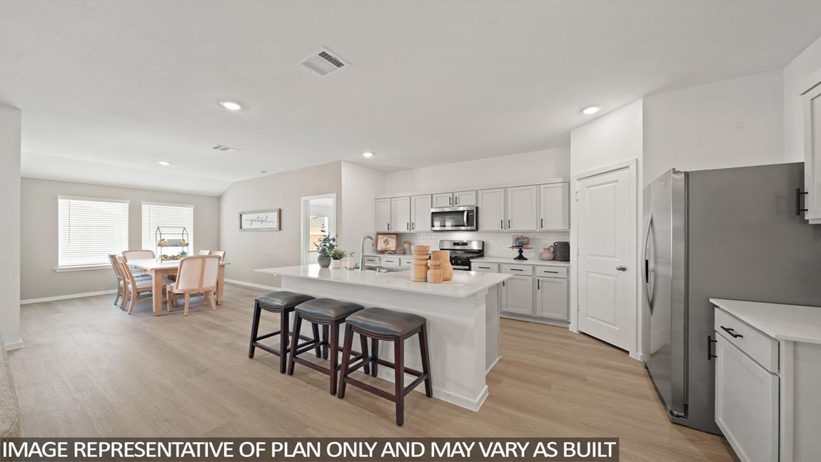 open concept living and dining area with vinyl flooring and quartz countertops