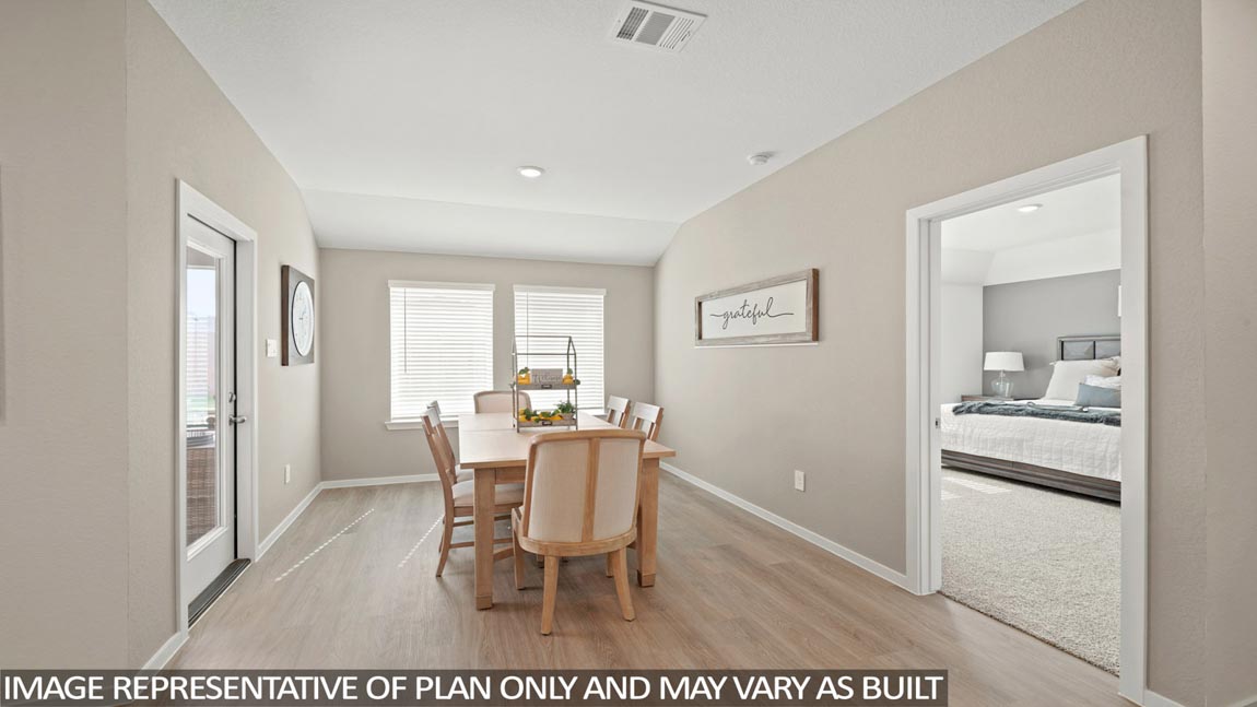 open concept living and dining area with vinyl flooring and quartz countertops