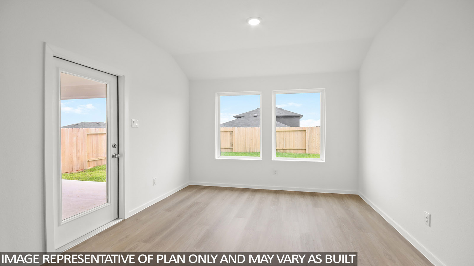 open concept living and dining area with vinyl flooring, large windows, and quartz countertops