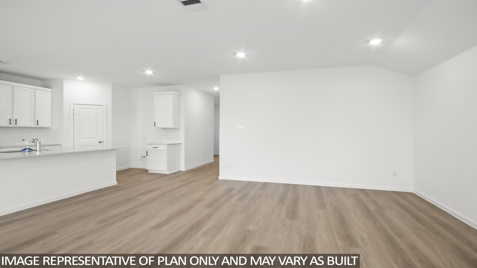 open concept living and dining area with vinyl flooring, large windows, and quartz countertops