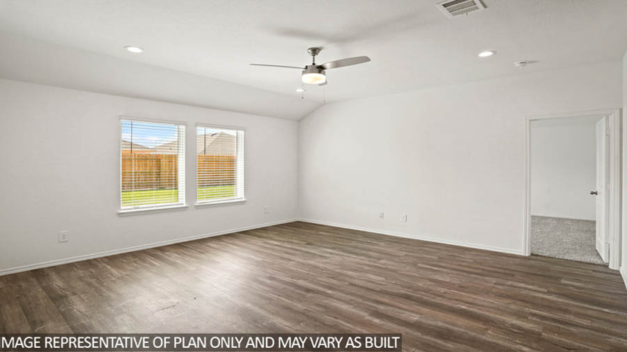 Spacious living area with vinyl flooring