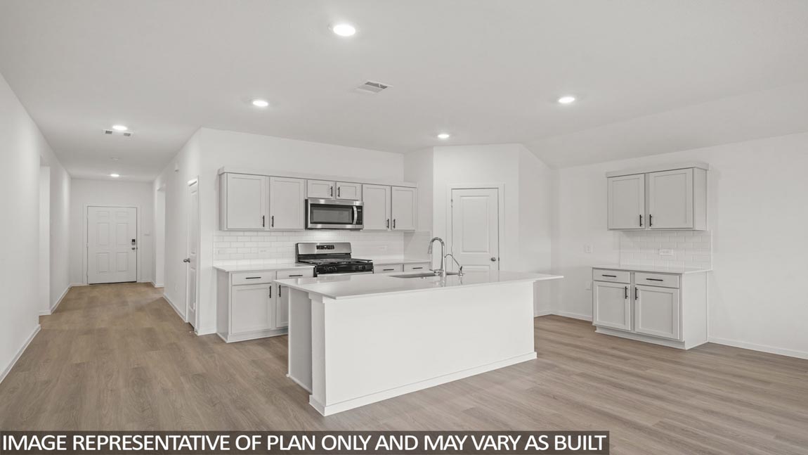 open concept living and dining are with vinyl flooring, quartz cuntertops, and large windows