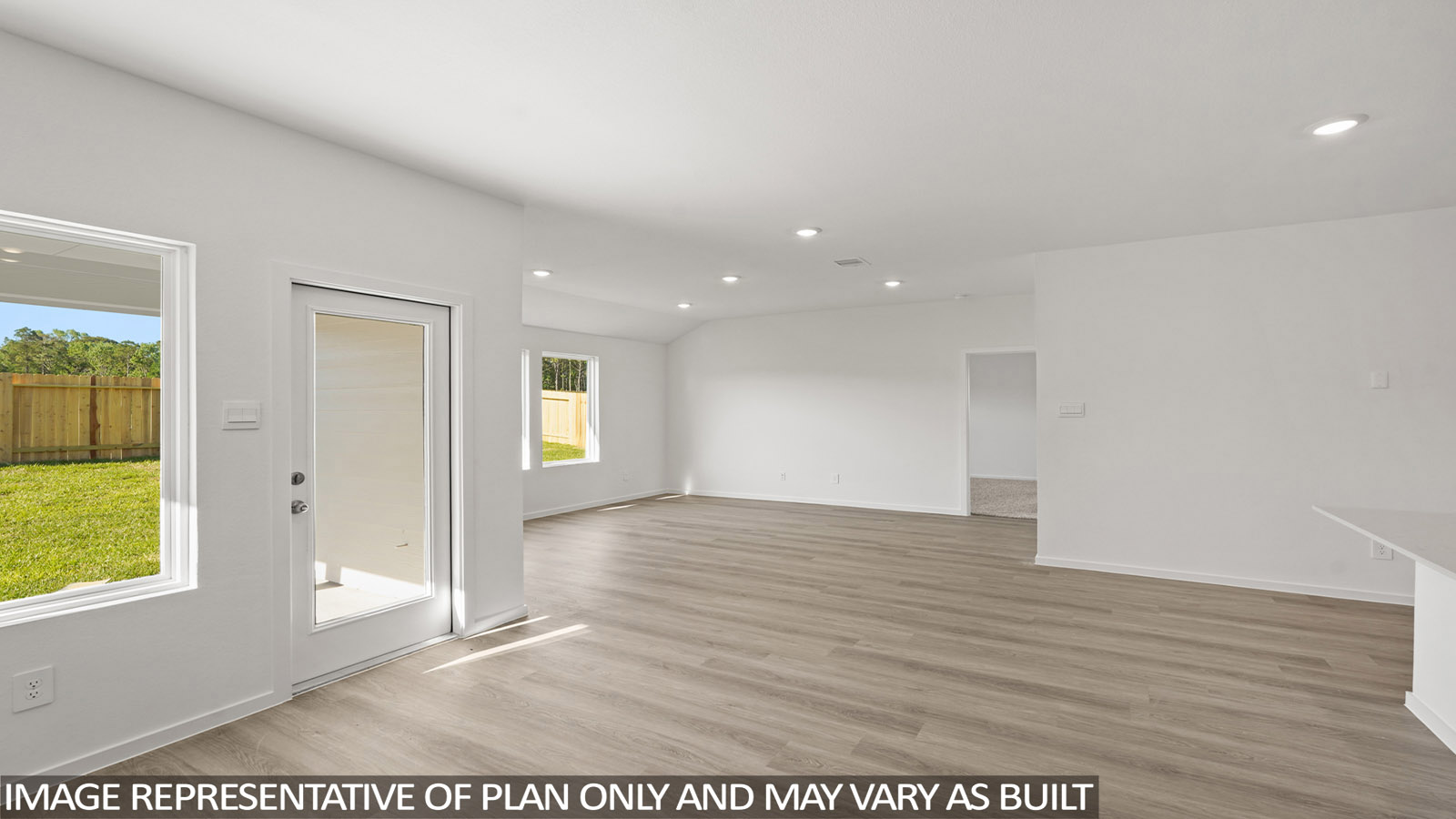 open concept living and dining area with vinyl flooring, large windows, and quartz countertops