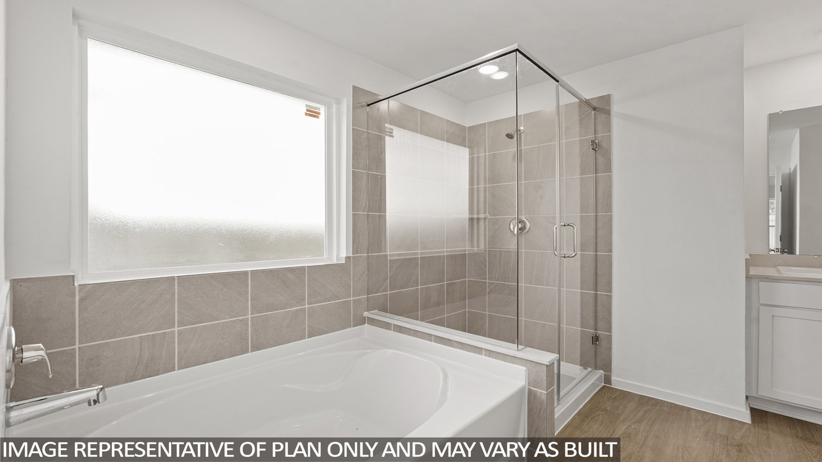 primary bathroom with separate tub and shower
