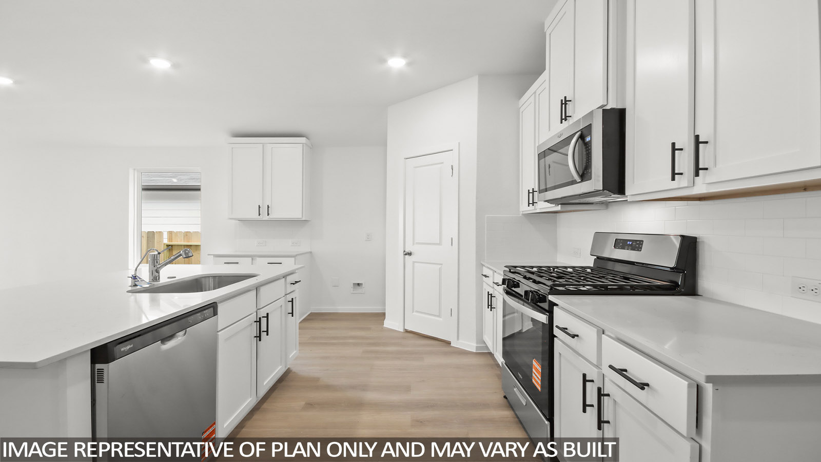 open concept living and dining area with vinyl flooring, large windows.