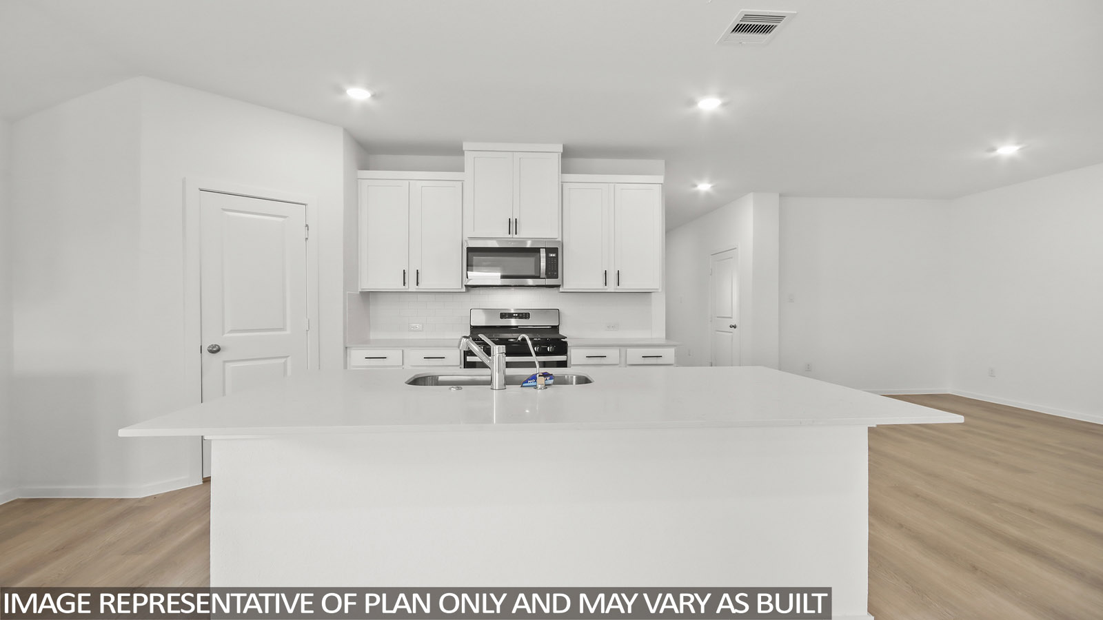 open concept living and dining area with vinyl flooring, large windows.