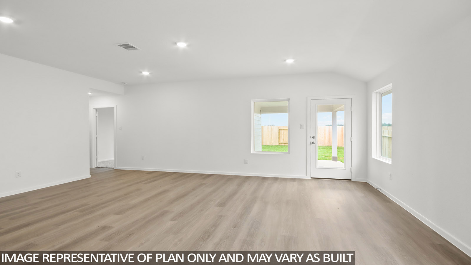 open concept living and dining area with vinyl flooring, large windows.