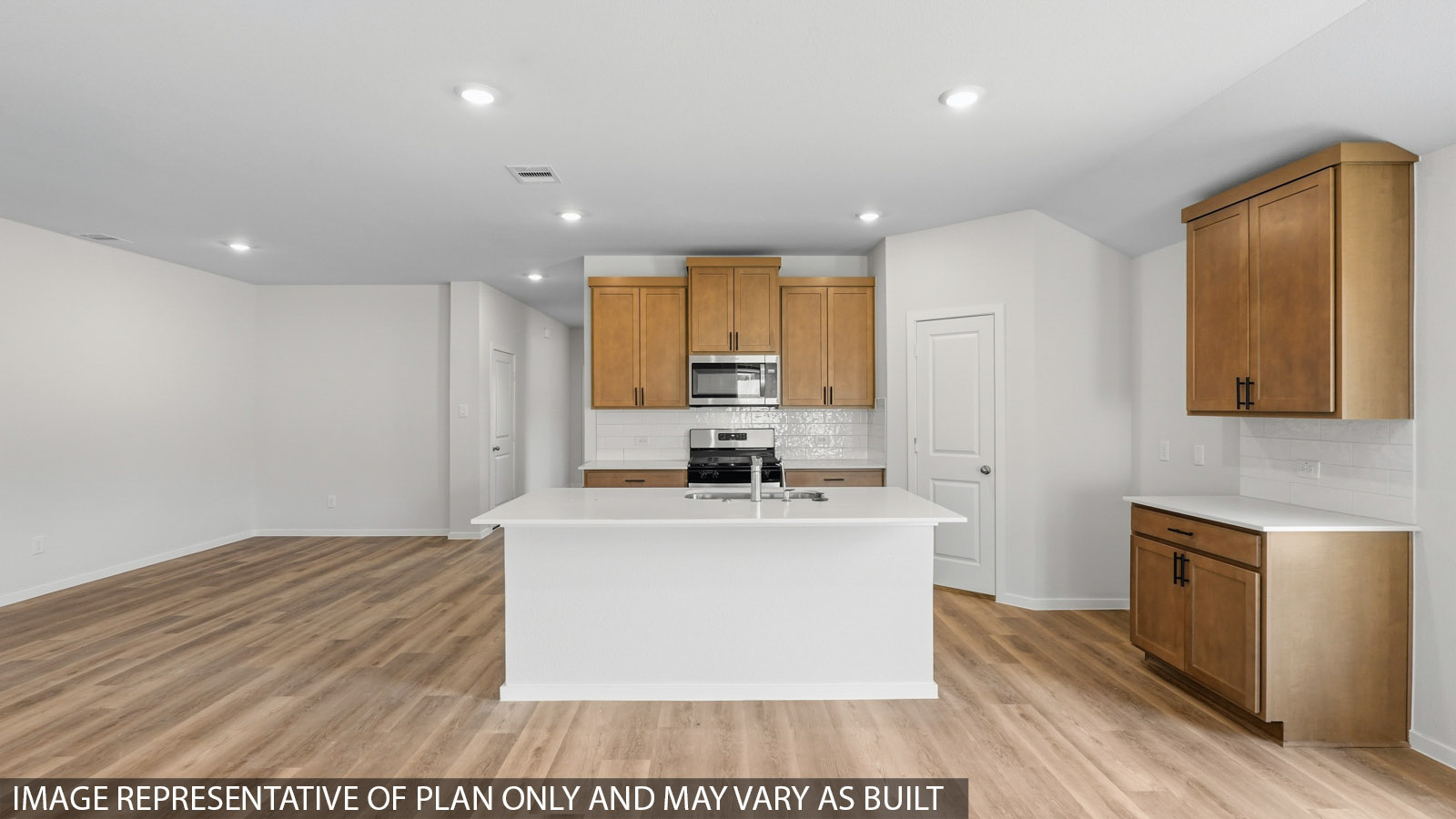 kitchen with quartz countertops, backsplash, and stainless steel appliances