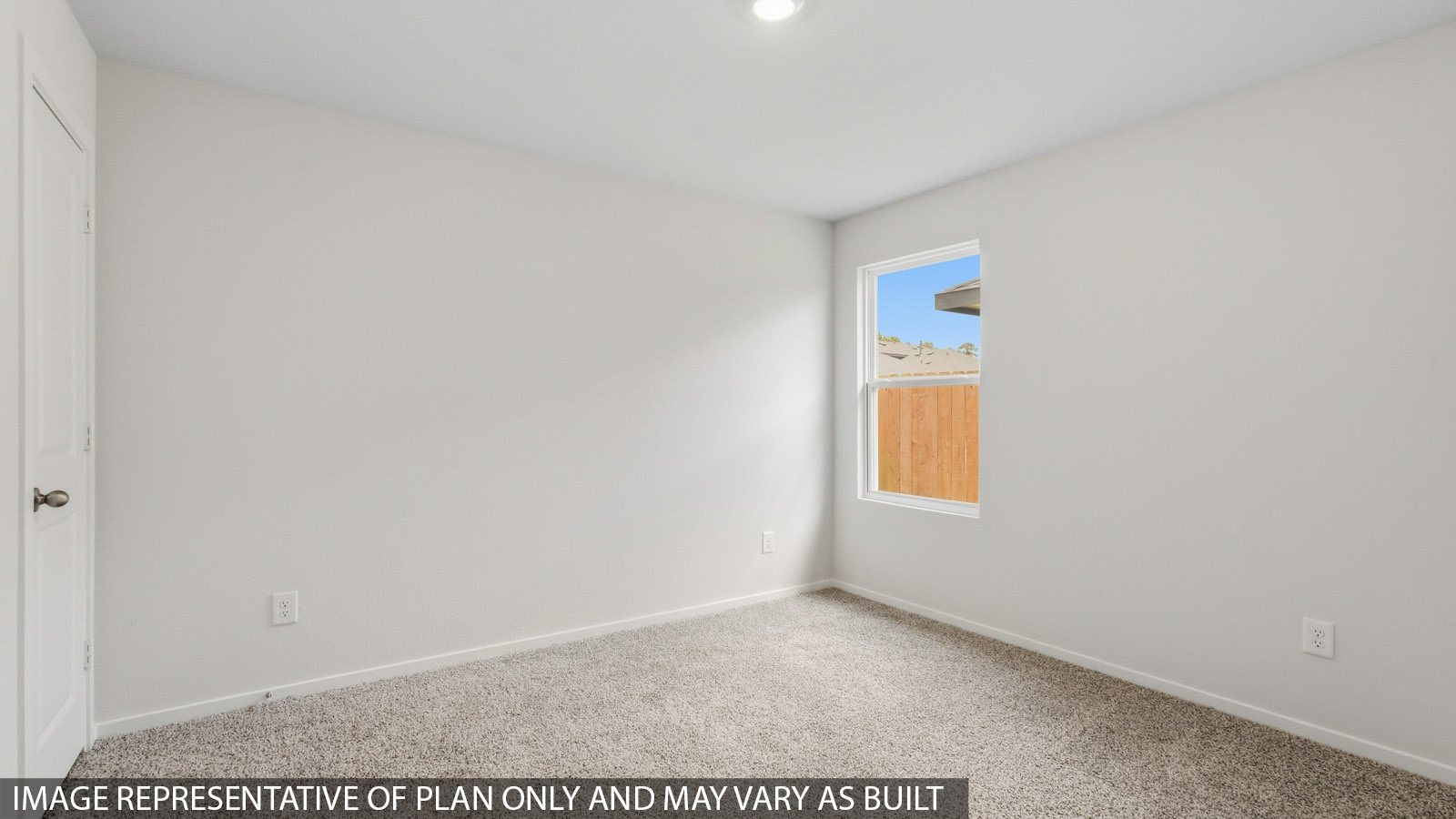 primary bedroom with carpet flooring