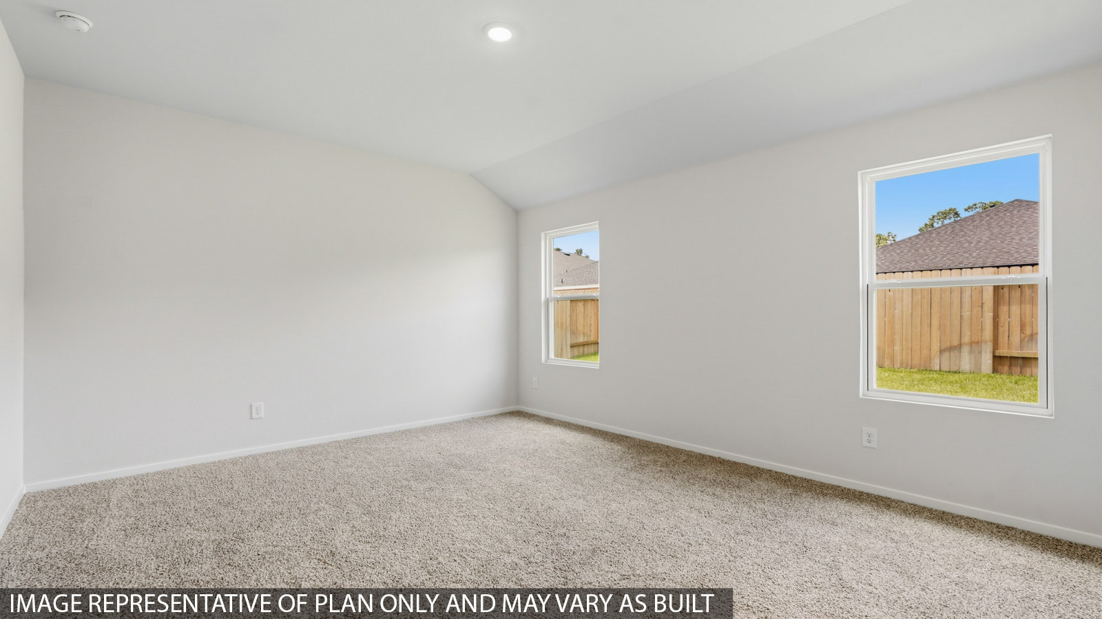 primary bedroom with carpet flooring