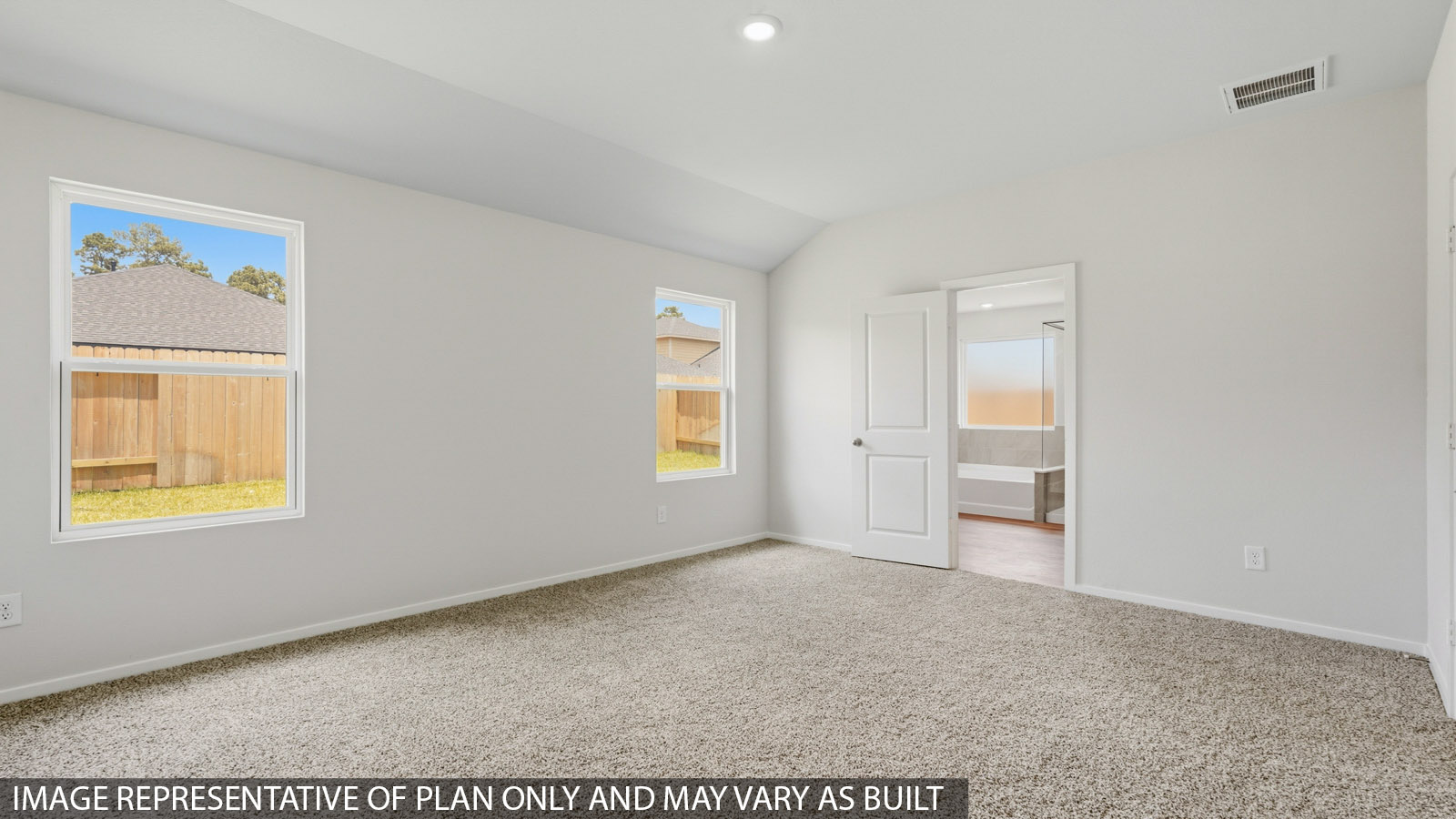primary bedroom with carpet flooring