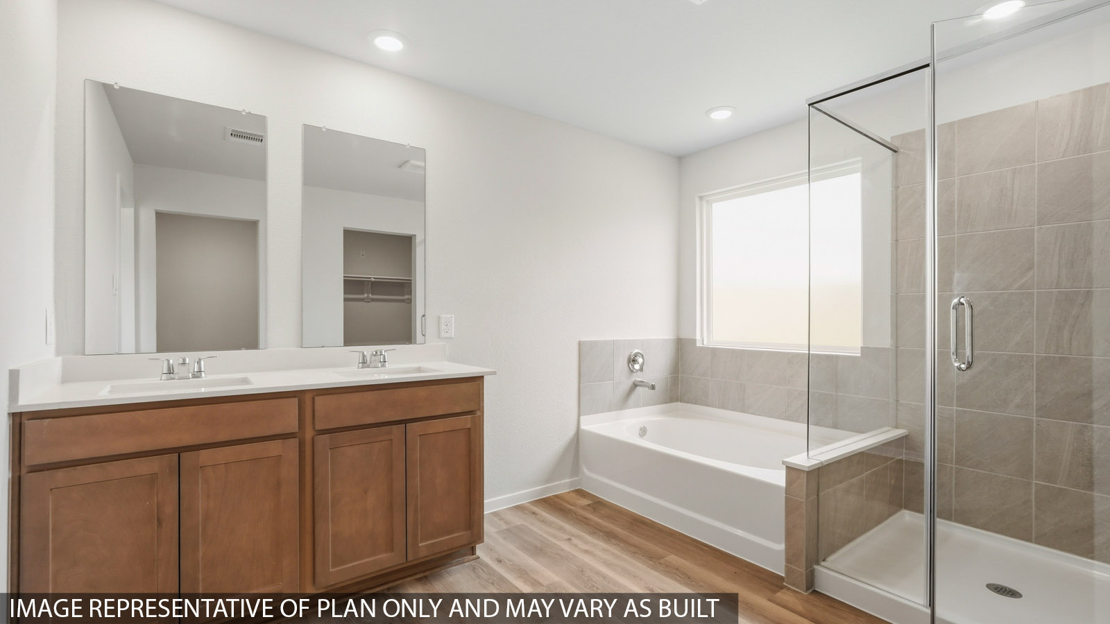 primary bathroom with separate tub and shower
