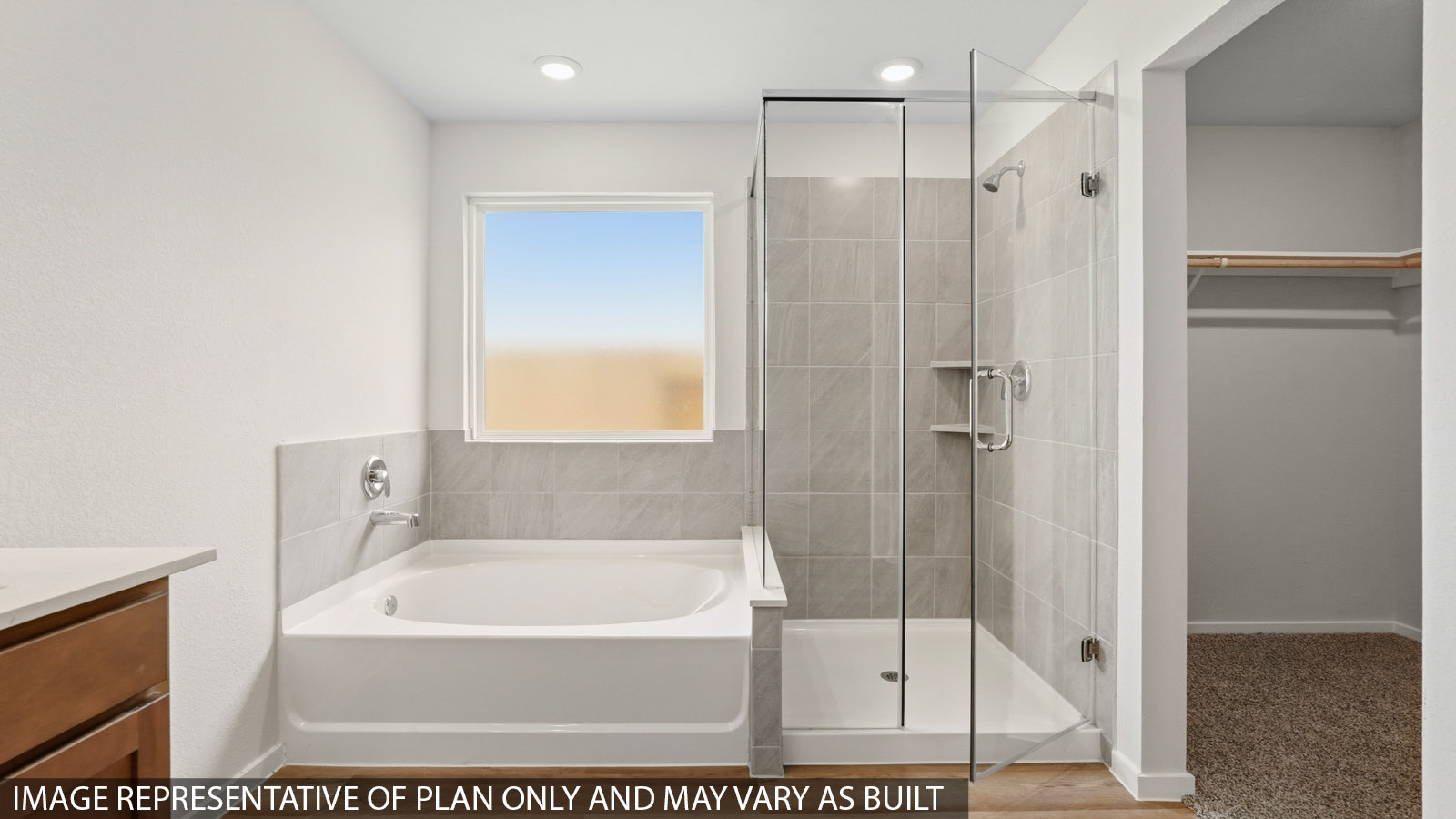 primary bathroom with separate tub and shower