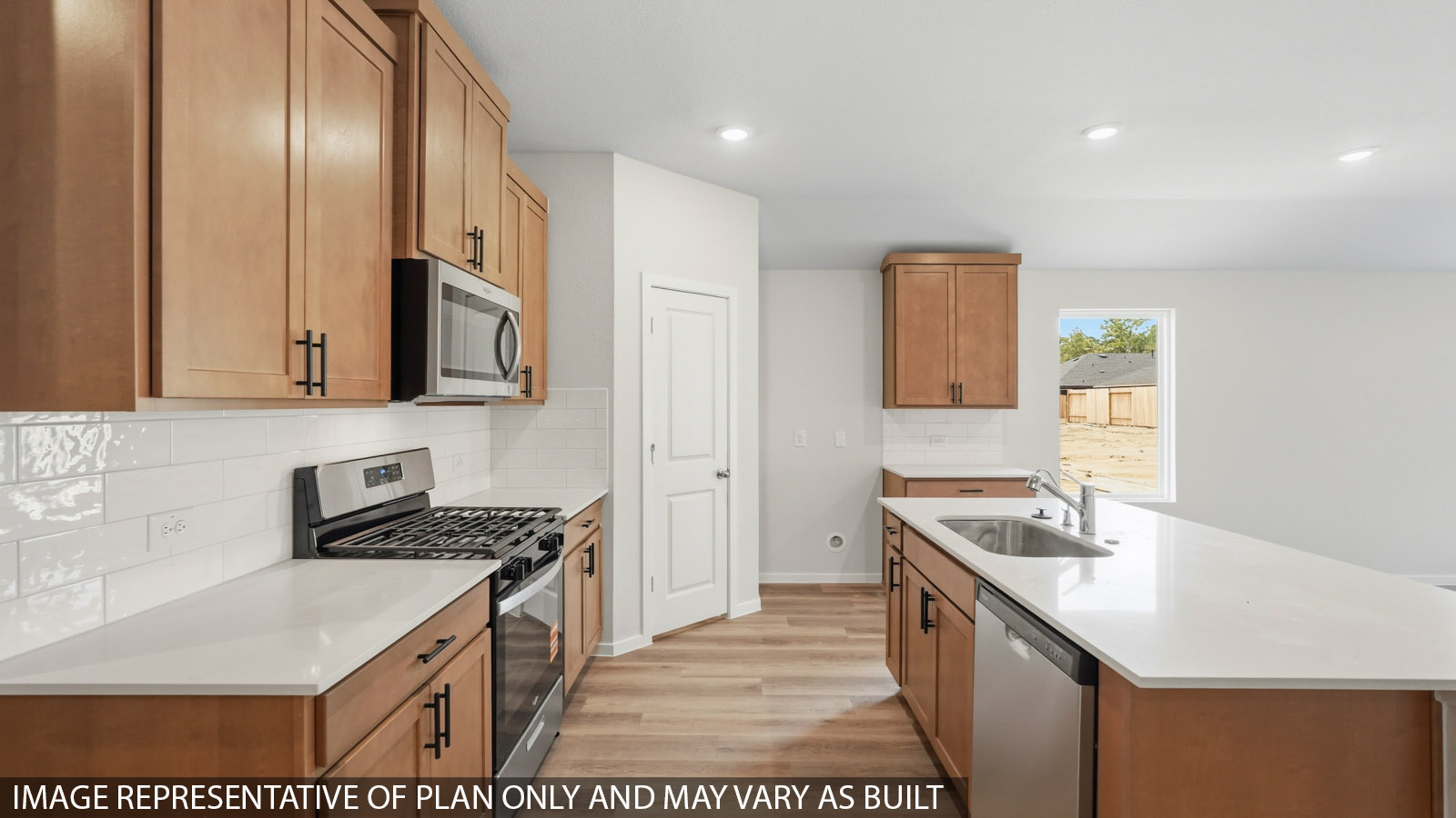 kitchen with quartz countertops, backsplash, and stainless steel appliances