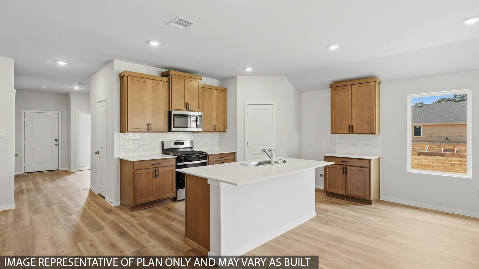 kitchen with quartz countertops, backsplash, and stainless steel appliances