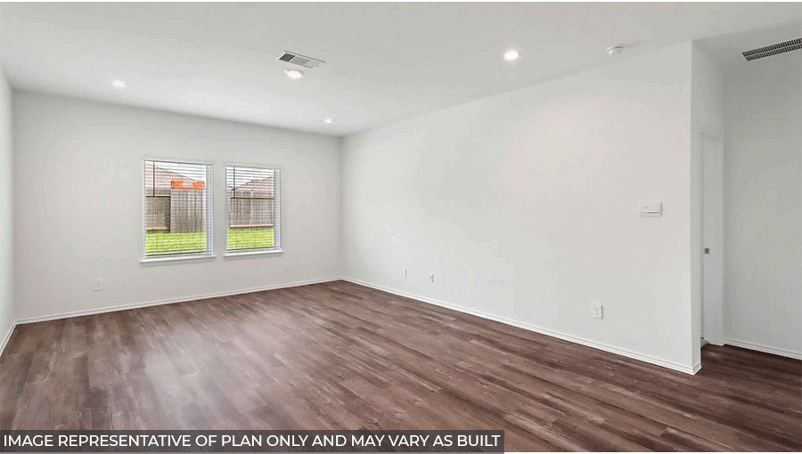 open concept living and dining area with vinyl flooring, quartz countertops, and large windows