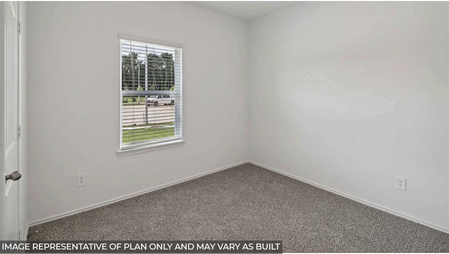 bedroom with carpet flooring and window in Magnolia, TX