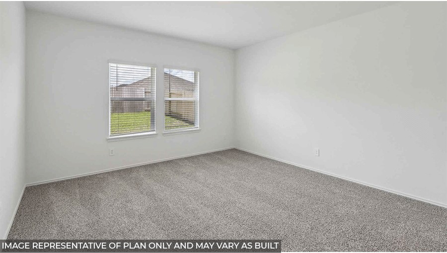 bedroom with carpet flooring and window in Magnolia, TX