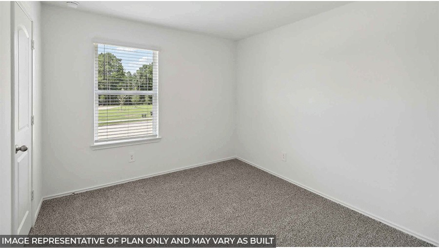 bedroom with carpet flooring and window in Magnolia, TX
