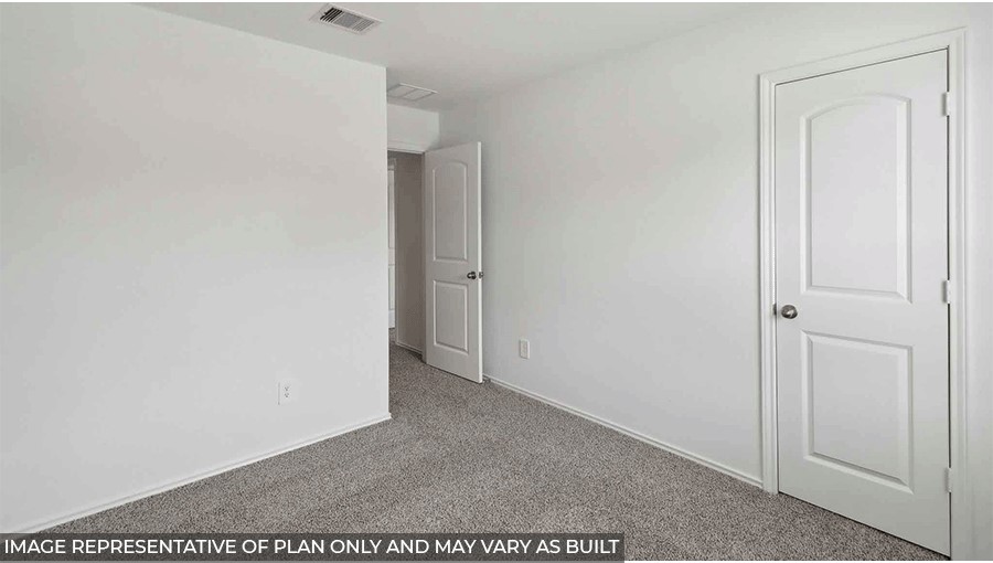 bedroom with carpet flooring and window in Magnolia, TX