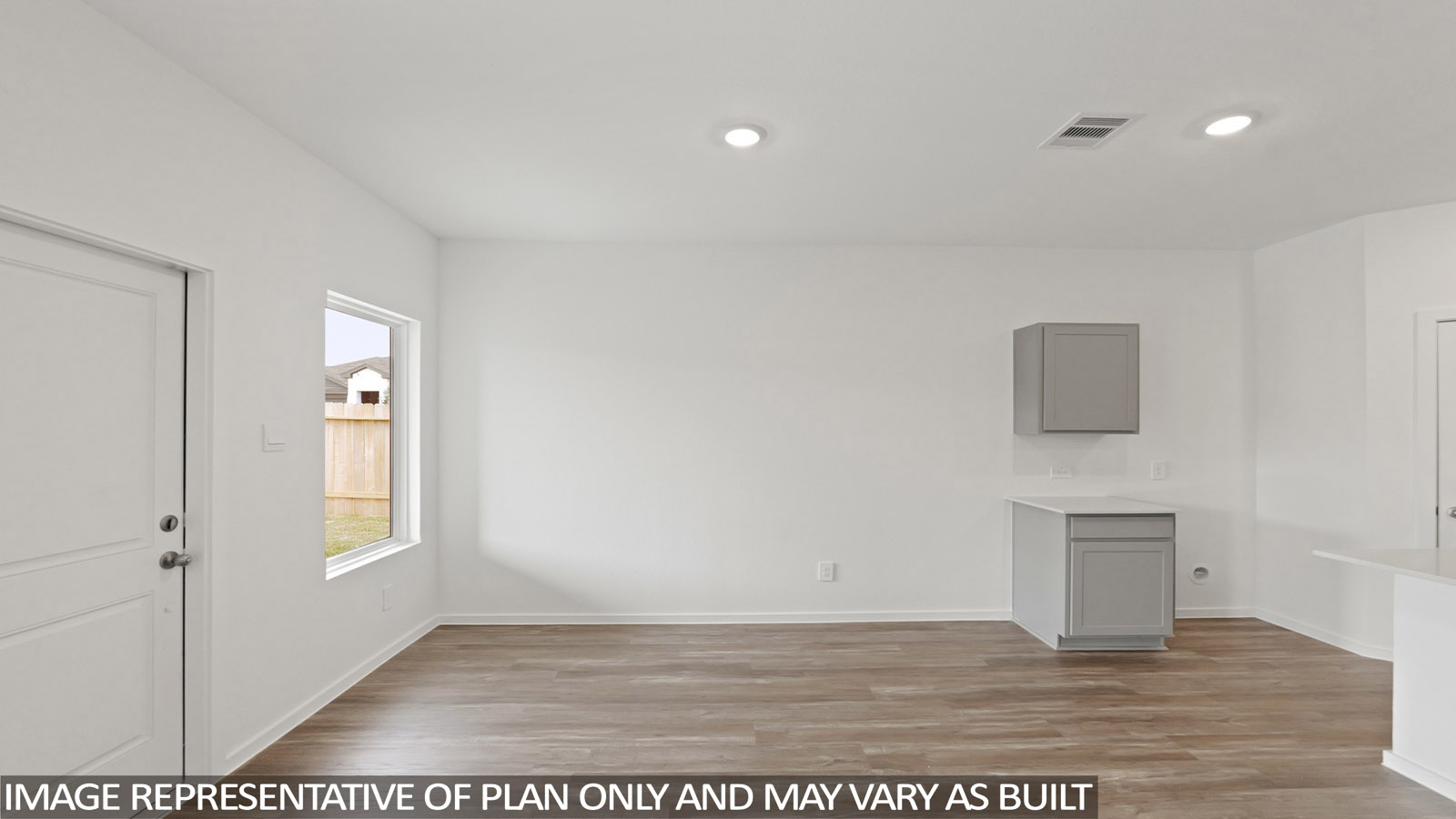 open concept living and dining area with vinyl flooring, stainless steel appliances, and quartz countertops