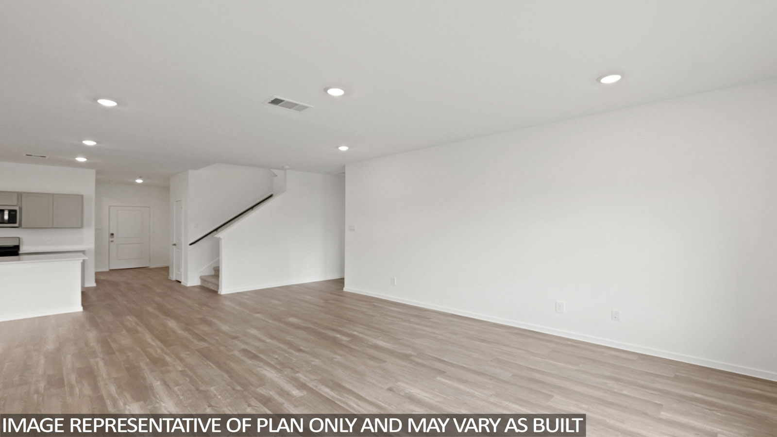 open concept living and dining area with vinyl flooring, stainless steel appliances, and quartz countertops