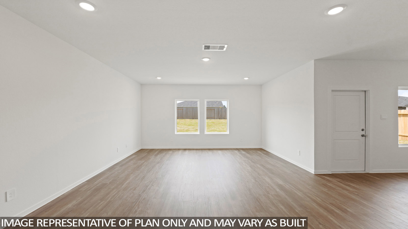 open concept living and dining area with vinyl flooring, stainless steel appliances, and quartz countertops