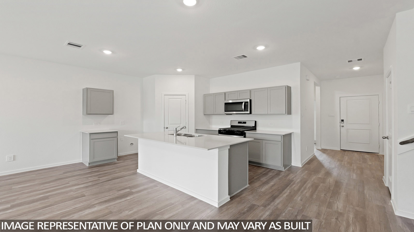open concept living and dining area with vinyl flooring, quartz countertops, and stainless steel appliances