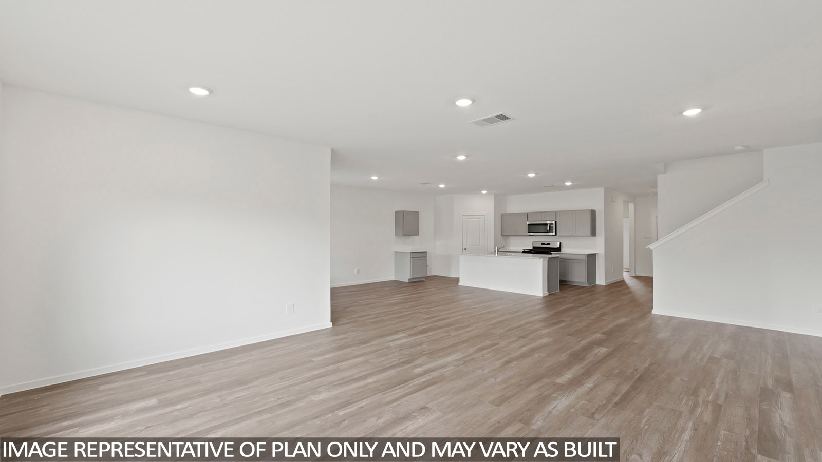 open concept living and dining area with vinyl flooring, quartz countertops, and stainless steel appliances