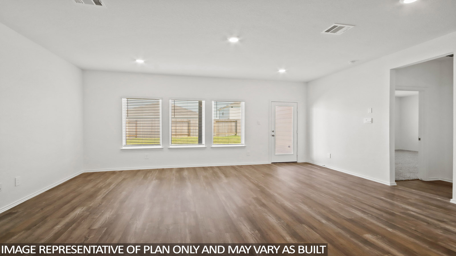 open concept living and dining area with vinyl flooring, large windows, and quartz countertops