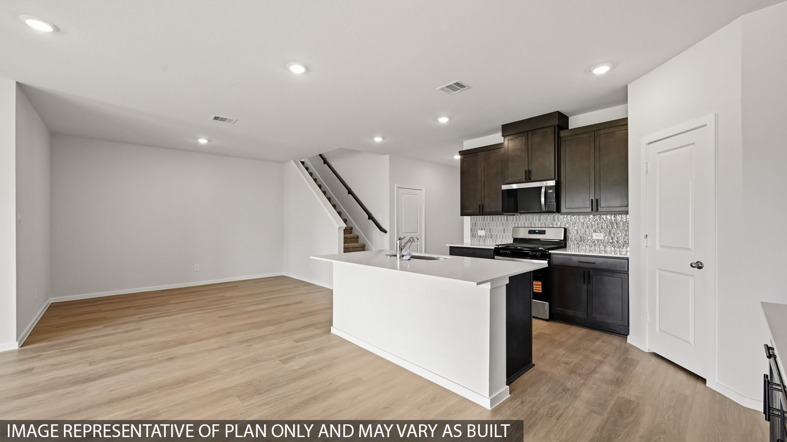 open concept living and dining area with vinyl flooring and large windows