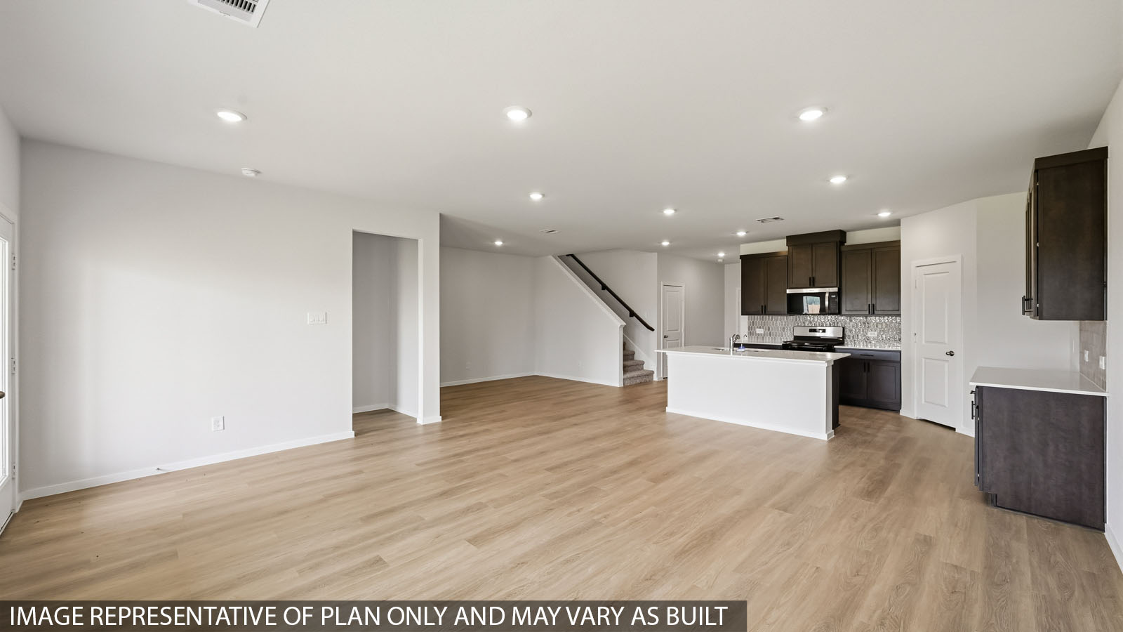 open concept living and dining area with vinyl flooring and large windows