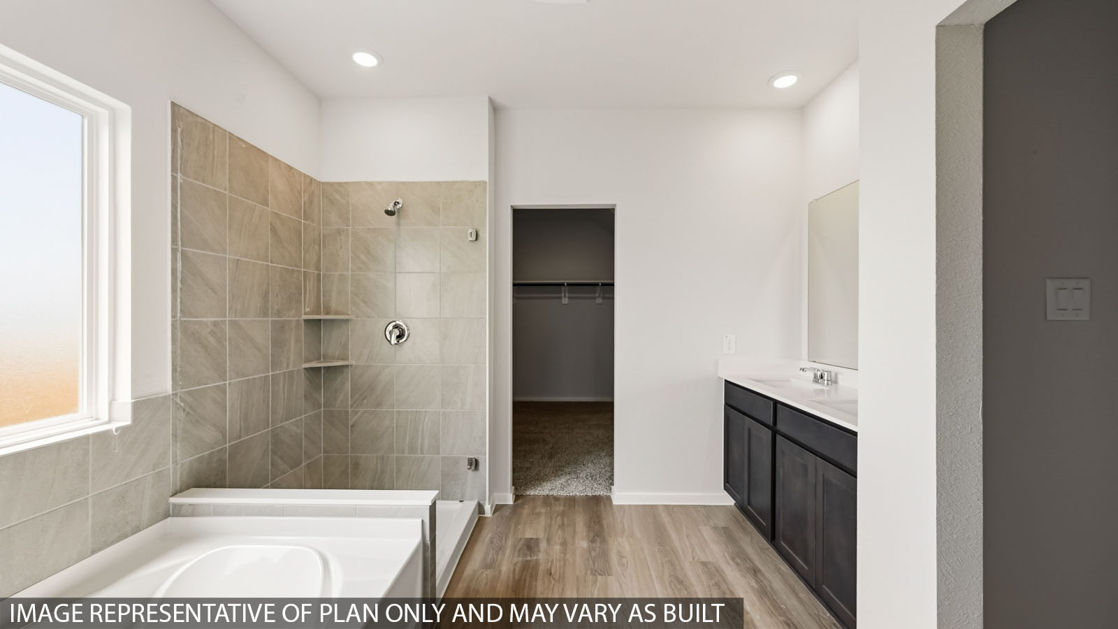 primary bathroom with separate tub and shower