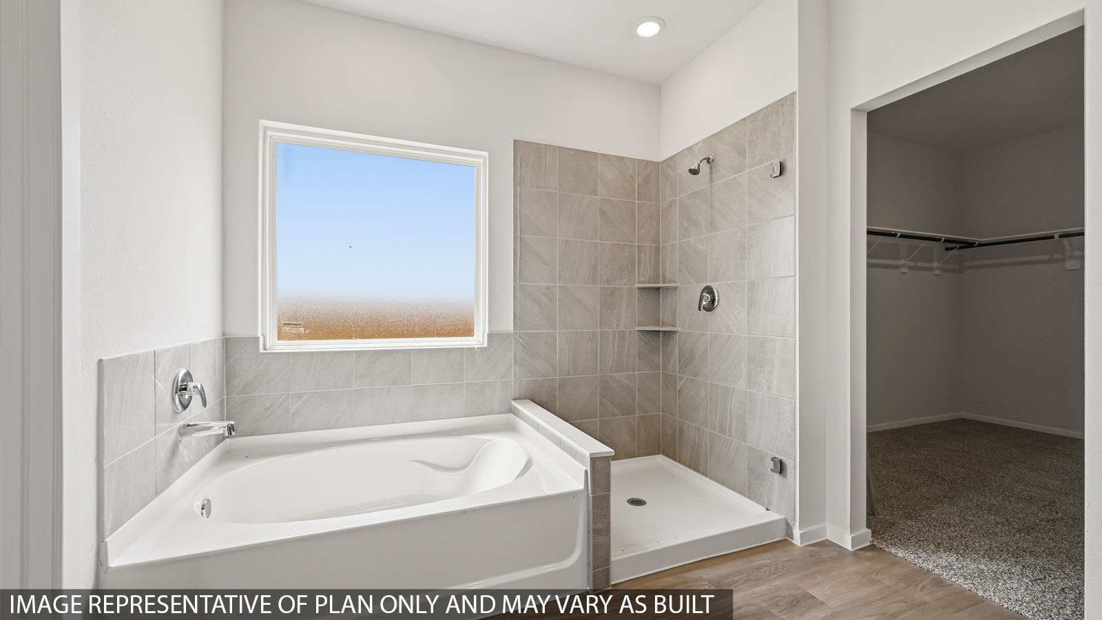 primary bathroom with separate tub and shower