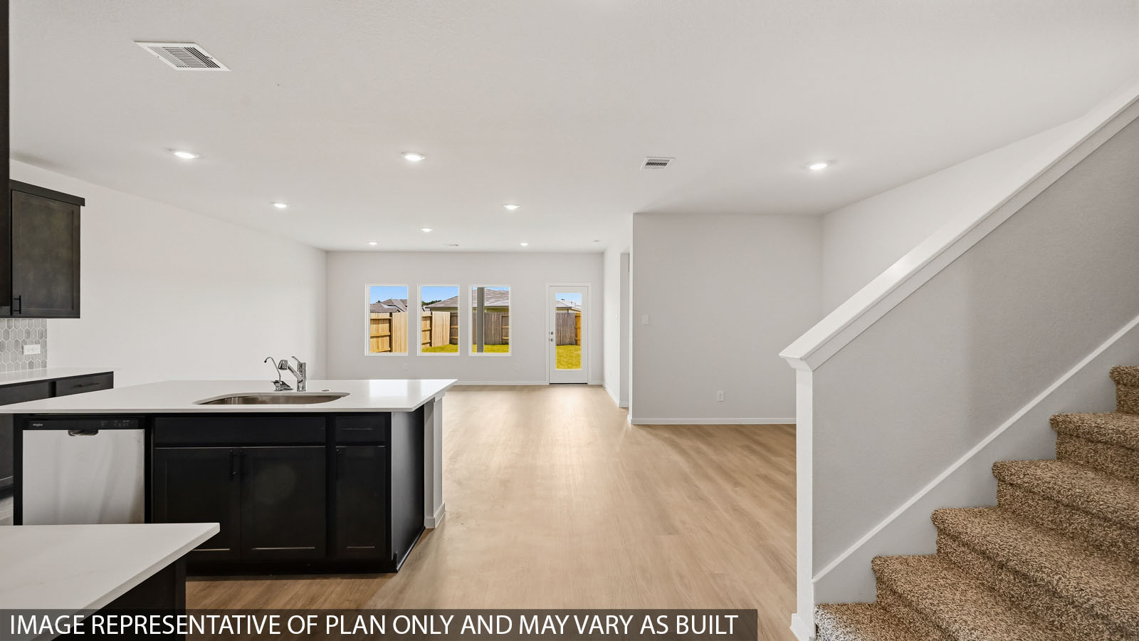 kitchen with quartz countertops, backsplash, and stainless steel appliances