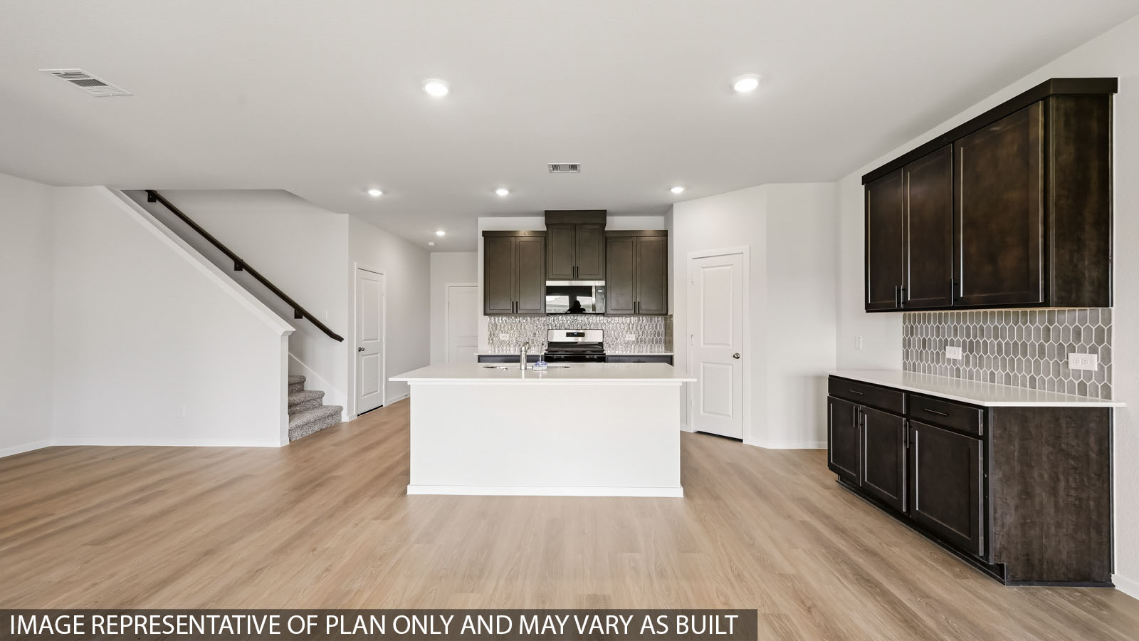 kitchen with quartz countertops, backsplash, and stainless steel appliances