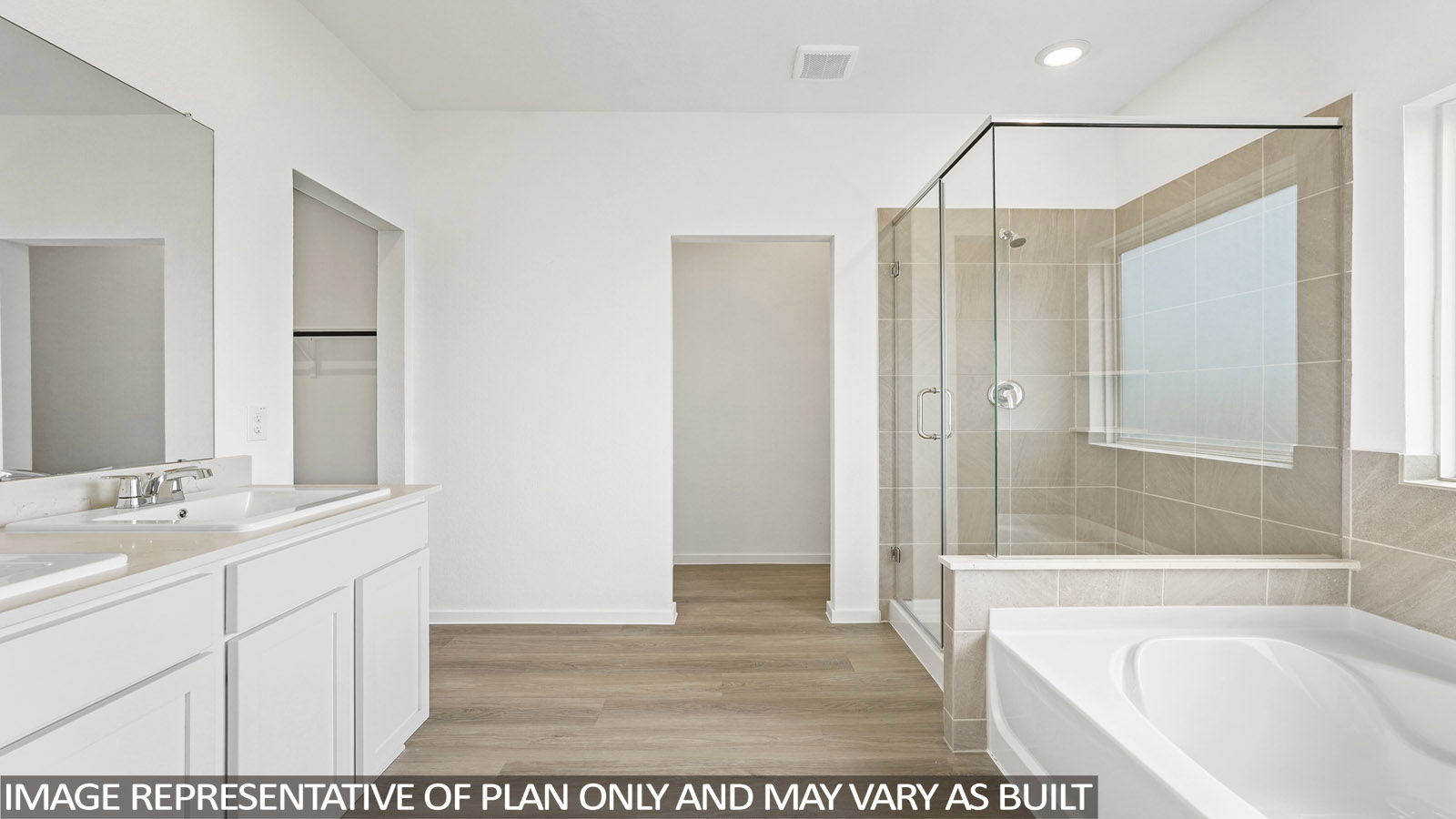 primary bathroom with separate tub and shower