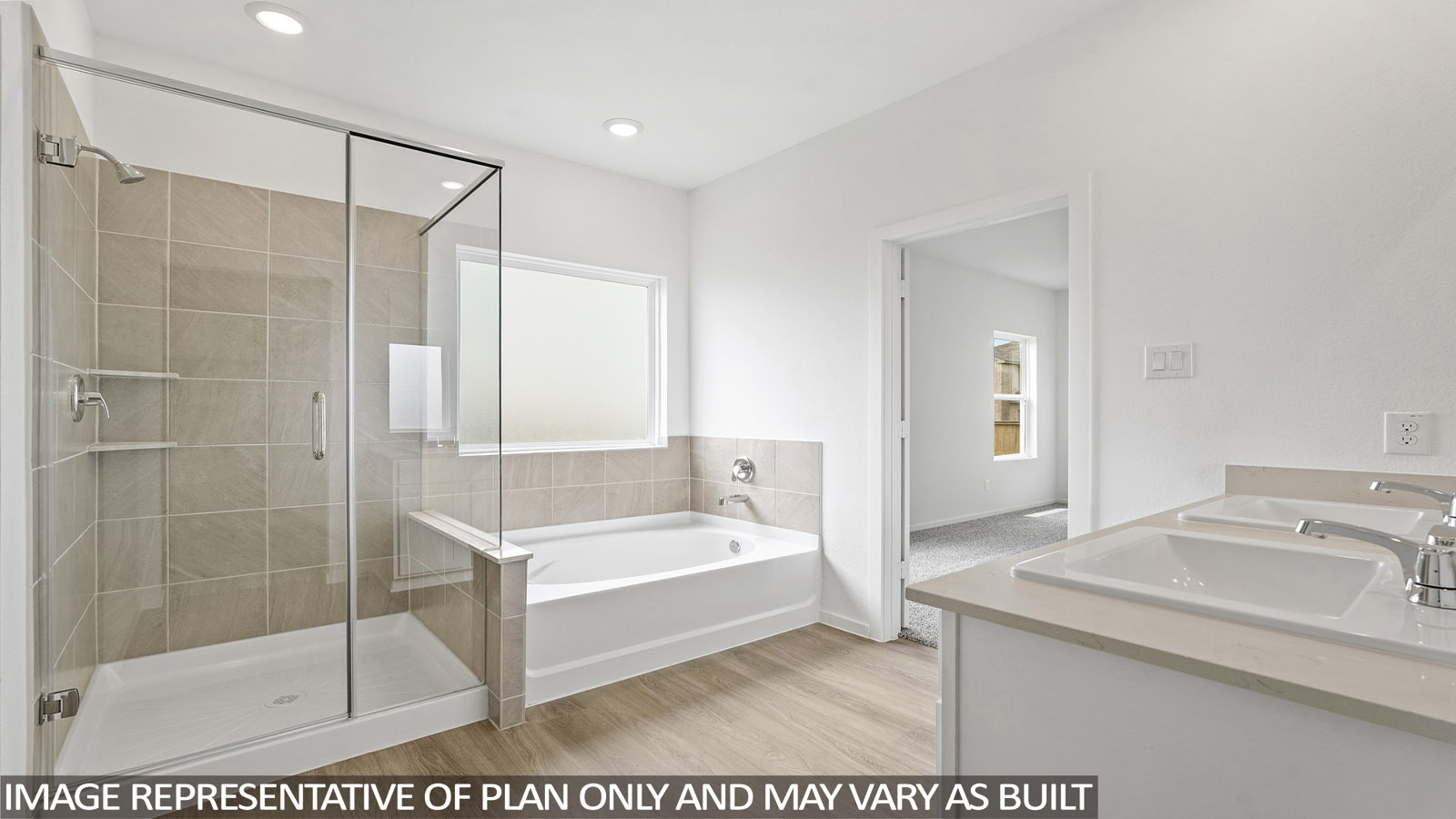 primary bathroom with separate tub and shower
