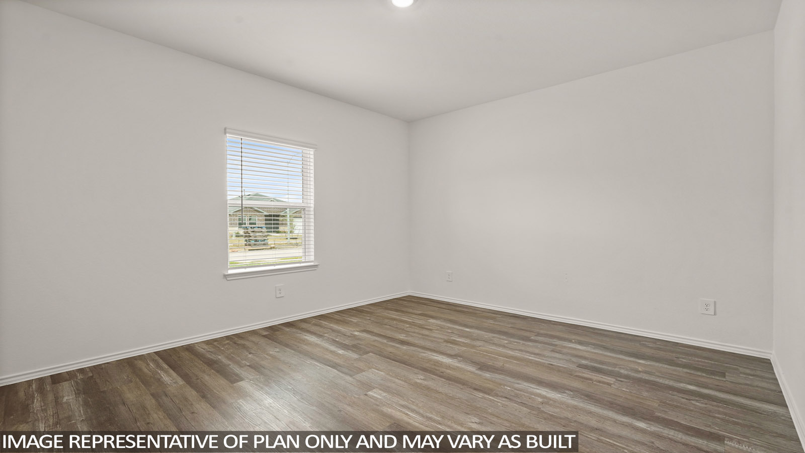 open concept living and dining area with vinl flooring, stainless steel appliances, and quartz countertops in Magnolia, TX