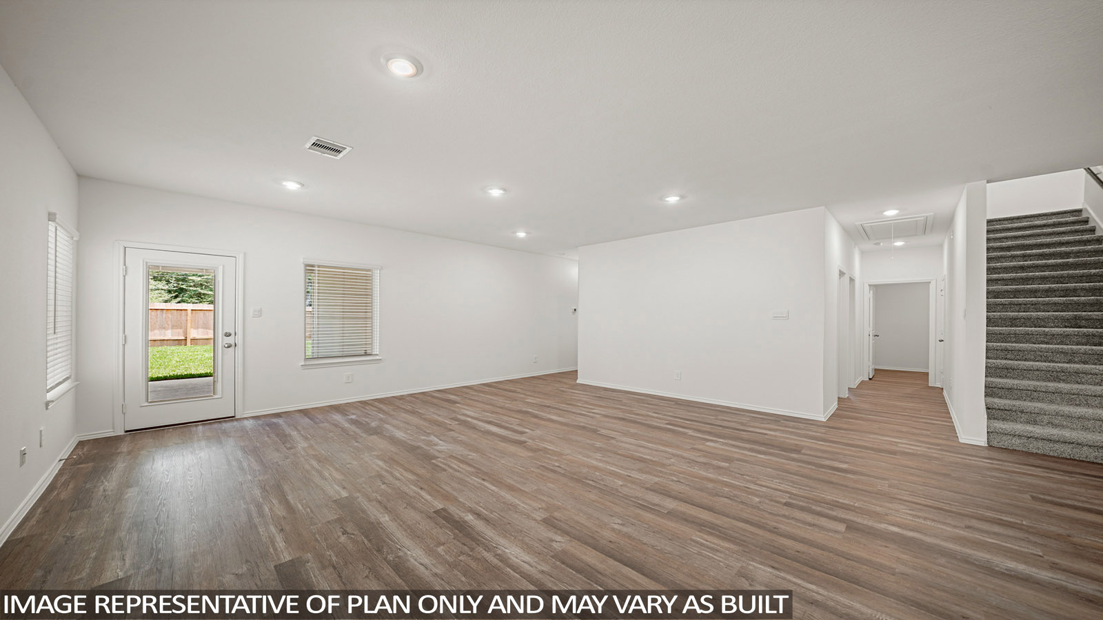 open concept living and dining area with vinyl flooring