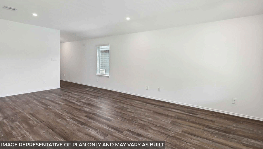 Open living room with windows, vinyl wood flooring, and white walls.