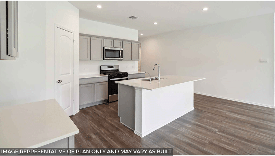 Open kitchen with an island, stainless steel appliances, light gray cabinets, white countertops, white walls, and vinyl wood flooring.