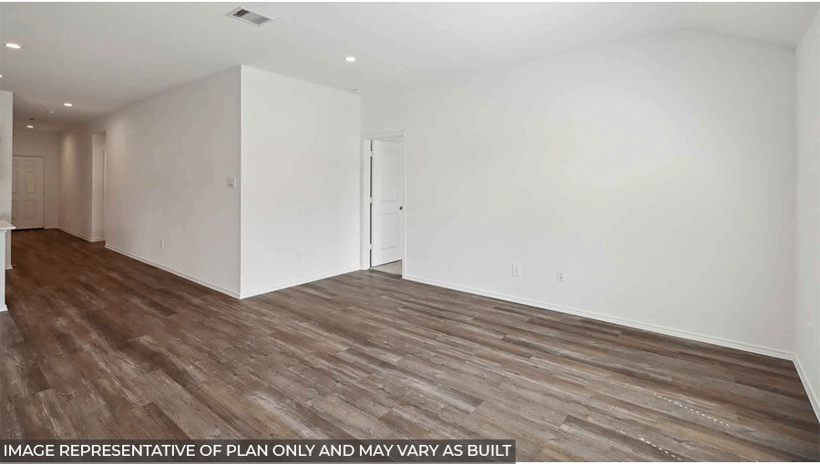 Open living room with large windows, white walls, and vinyl wood flooring.