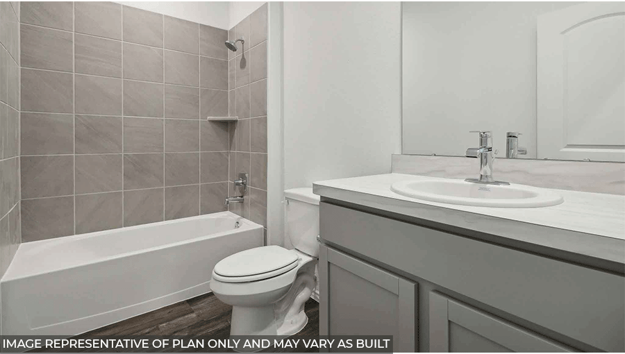 Secondary bathroom with a shower and tub combo, a sink, light gray cabinets, white countertop, white walls, and vinyl wood flooring.