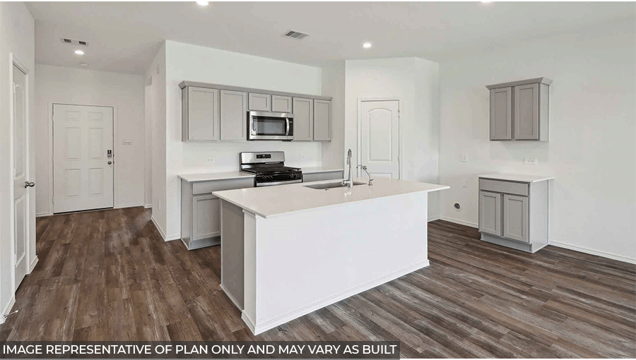 Open kitchen with stainless steel appliances, and island, light gray cabinets, white counter tops, white walls, and vinyl wood flooring.