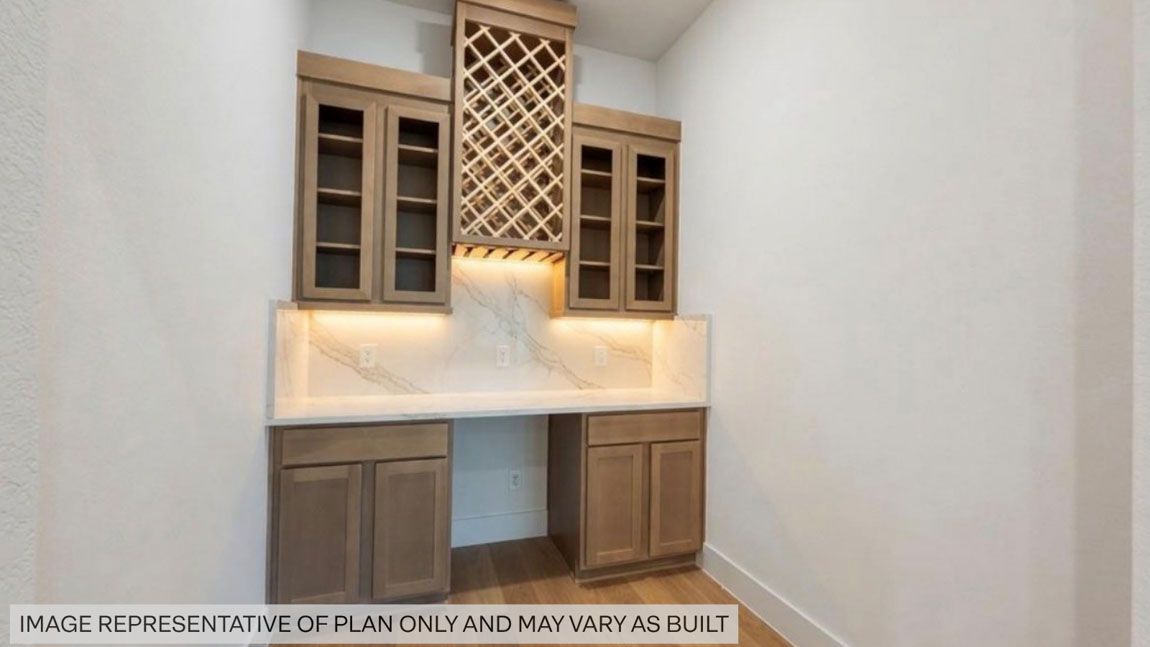 Beautiful wine bar with elegant cebinets in Pinehurst TX Butlers Bend Estates community